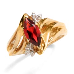 Unforgettably marvelous. 10K yellow gold ring has a 10x5mm marquise garnet with 2 round diamonds. Garnet is January's birthstone. (The gemstones pictured may have been treated or enhanced by heating.)  