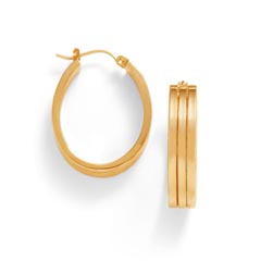 A deserved indulgence. Oval square tube hoop earrings are 14K yellow gold and have hinged backs.  